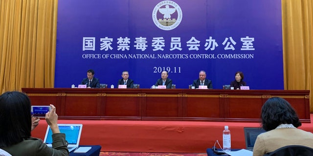 Chinese and U.S. enforcement officers hold a press conference on cracking down on fentanyl trafficking in Xingtai in northern China's Hebei province on Thursday, Nov. 7, 2019.