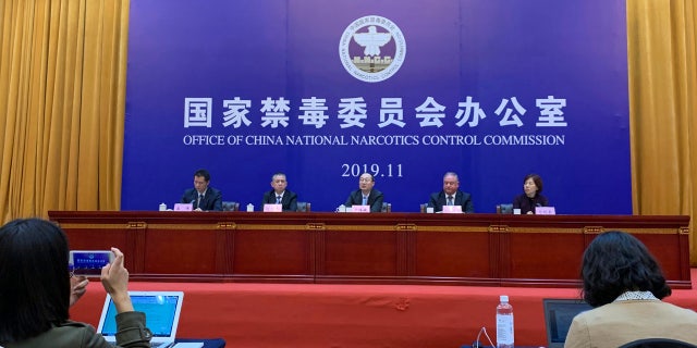 Chinese and U.S. enforcement officers hold a press conference on cracking down on fentanyl trafficking in Xingtai in northern China's Hebei province on Thursday, Nov. 7, 2019.