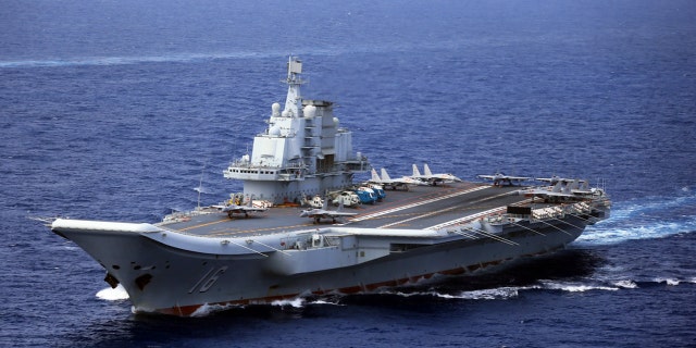 The Chinese Navy fleet's still-unnamed carrier (not pictured) was the latest vessel to pass through the strait. Its last vessel to make the voyage was the aircraft carrier Liaoning (pictured above) in June. (Getty, File)