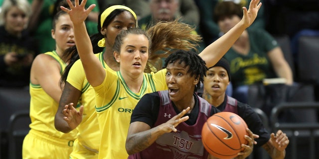 Texas Southern's Ciani Cryor, front, looks for an open teammate while under pressure from Oregon's Erin Boley, left, Ruthy Hebard and Taylor Chavez during the first quarter of an NCAA college basketball game in Eugene, Ore., Saturday, Nov. 16, 2019. (AP Photo/Chris Pietsch)