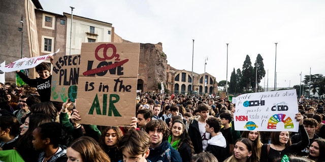 Young people attend a protest of the Fridays For Future movement in Rome, Italy, Friday, Nov. 29, 2019. Environmentalists around the world joined a global day of protests, in a symbolic gesture to demand that governments act against climate change. (Angelo Carconi/ANSA via AP)