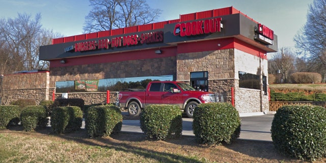 Taren Woods, a 10-year employee of Cook Out and the officer in charge, claims she was fired after a cashier refused service to a police officer, even though the woman followed the company's policy by asking another cashier to take the order.