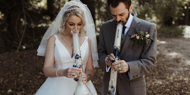 The bride and groom celebrated their new union not with a champagne toast using personalized glasses – but with a bong rip using specially-made “Mr” and “Mrs” glass water pipes.