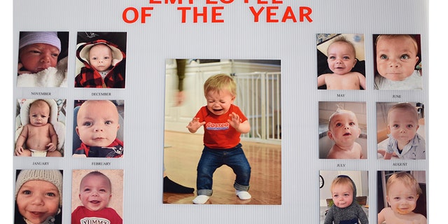 Mason is named “employee of the year” on a sign with pictures of the toddler for each month in the first year of his life. (Photo: Courtesy of Josie Gonzalez)