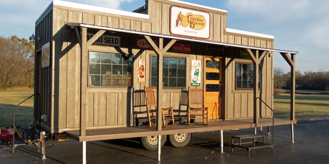 The tiny house will replicate the experience of visiting the iconic country home store, complete with front porch and wooden rocking chairs.