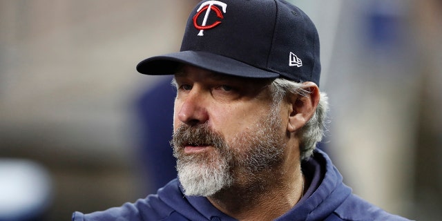 FILE- In this Aug. 30, 2019, file photo, Minnesota Twins bench coach Derek Shelton watches from the dugout during a baseball game against the Detroit Tigers in Detroit. Shelton is the new manager of the Pittsburgh Pirates, the team announced Wednesday, Nov. 27, 2019. (AP Photo/Carlos Osorio, File)