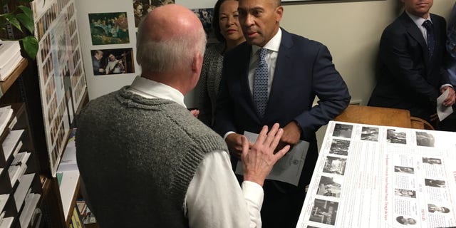 Newly announced Democratic presidential candidate and former Massachusetts Gov. Deval Patrick speaks with New Hampshire Secretary of State Bill Gardner as he files to place his name on the first-in-the-nation presidential primary ballot, in Concord, NH on Nov. 14, 2019