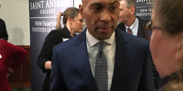 Newly declared Democratic presidential candidate and former Massachusetts Gov. Deval Patrick speaks with an audience member after headlining 'Politics and Eggs' at the New Hampshire Institute of Politics at Saint Anselm College in Manchester, NH on Nov. 25, 2019