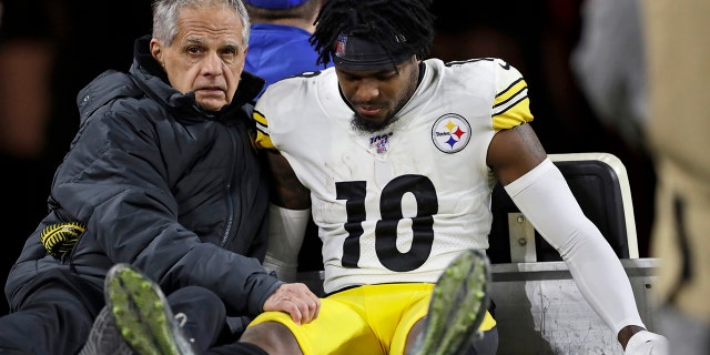Pittsburgh Steelers wide receiver Diontae Johnson (18) carted back to the locker room after getting hit by Cleveland Browns strong safety Damarious Randall during the second half of an NFL football game, Thursday, Nov. 14, 2019, in Cleveland. Randall was ejected from the game.