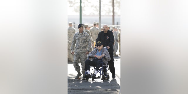 Airman 1st Class Jonathan Realegeno accompanied a veteran last month during the Stand Down. (U.S. Air Force photo by Airman 1st Class Hanah Abercrombie)
