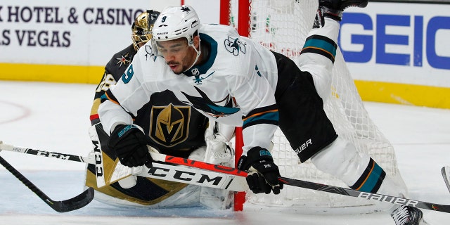 San Jose Sharks left wing Evander Kane (9) falls to the ice during the third period of the team's NHL hockey game against the Vegas Golden Knights, Thursday, Nov. 21, 2019, in Las Vegas.