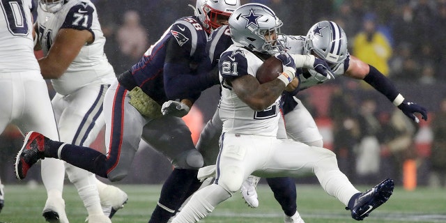 Latest Sports News: Dallas Cowboys running back Ezekiel Elliott carries the ball as New England Patriots linebacker Jamie Collins, left, gives chase in the first half of an NFL football game, Sunday, Nov. 24, 2019, in Foxborough, Mass. (AP Photo/Elise Amendola)