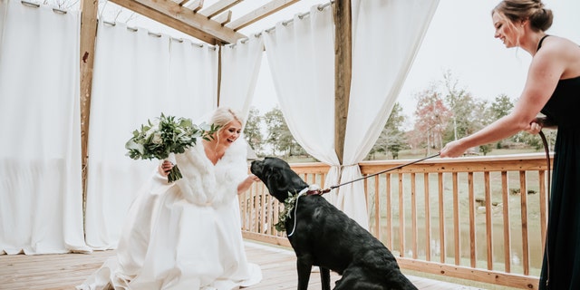 "Duncan decided pretty early on that he wanted to see me for the first time walking down the aisle with my father, rather than a ‘first look.’ In passing, we joked about me doing one with Zeke," bride Kristen Dupree said.