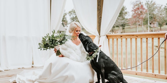 "In the middle of a busy day of hair, makeup, setting up and pictures, it was nice to just love on my dog."