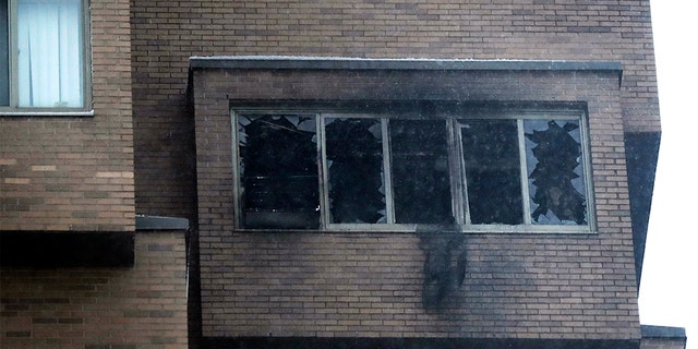 Broken windows and damage remain after a deadly fire at the high-rise apartment building Wednesday, Nov. 27, 2019, in Minneapolis. (David Joles/Star Tribune via AP)