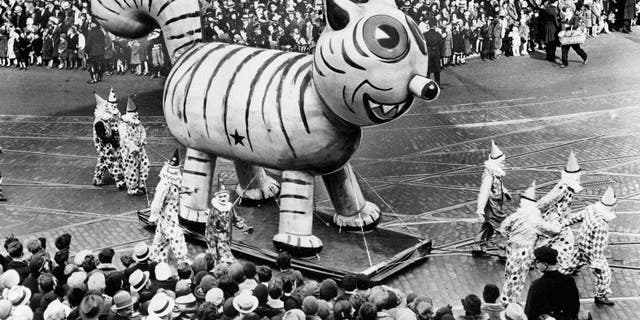 An outdoor float of a big cat makes its way down a street during the Thanksgiving Day Parade in New York City on Nov. 26, 1931. (AP Photo)