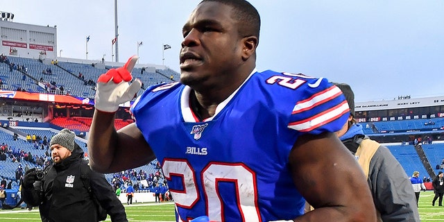 Buffalo Bills running back Frank Gore walking off the field after the Bills beat the Denver Broncos 20-3 Sunday. (AP Photo/Adrian Kraus)