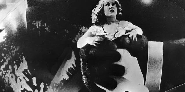 American actress Fay Wray in the clutches of King Kong, in a scene from the old Hollywood movie "King Kong" directed by Merian C Cooper and Ernest B Schoedsack for RKO.