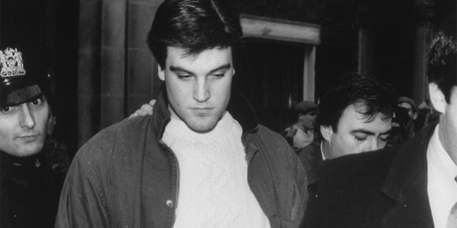 A stoic Robert Chambers leaving his townhouse surrounded by police and taunting crowds to begin serving time for murdering Jennifer Levin.