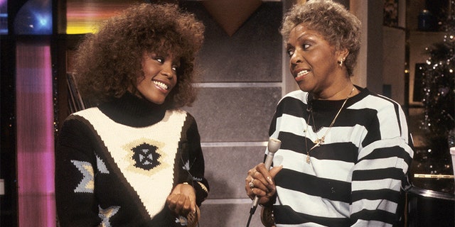 From left, American vocalist Whitney Houston and her mother, fellow singer Cissy Houston, appear during a taping of an MTV show, New York, New York, 1989.