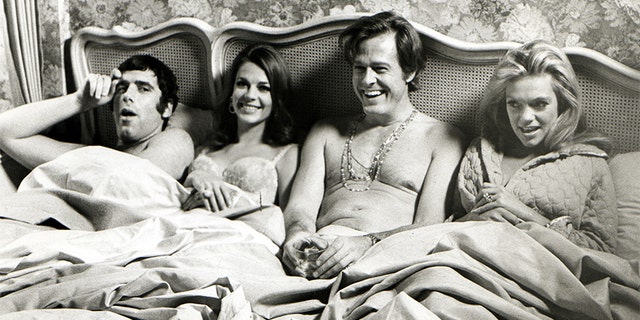 (Left to right) Elliott Gould, Natalie Wood, Robert Culp and Dyan Cannon in a promotional still from the 1969 film, "Bob and Carol and Ted and Alice."