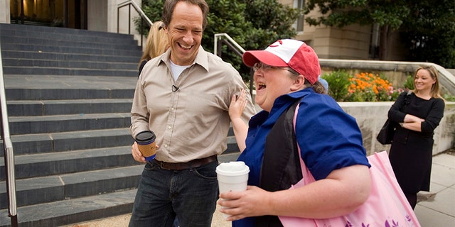 Mike Rowe of the television series 'Dirty Jobs' talks with fan Lori Shepard of the Senate Intelligence Committee, before an event to kick of American Equipment Manufacturers (AEM) advocacy campaign 'I Make America,' held at the Reserve Officers Association. The campaign is a national grassroots effort to strengthen American manufacturing jobs in the U.S. to improve the economy and global competitiveness.