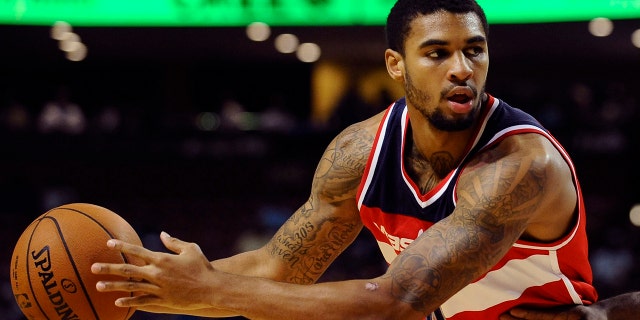 FILE - In this Oct. 10, 2014, file photo, Washington Wizards guard Glen Rice Jr. (14) looks to score during the first half of a preseason NBA basketball game against Charlotte Hornets in Greenville, S.C. Former Washington Wizards guard Glen Rice Jr. pleaded not guilty to a single charge of injuring with intent when he appeared in an Auckland court on Wednesday, Nov. 20, 2019. (AP Photo/Rainier Ehrhardt, File)