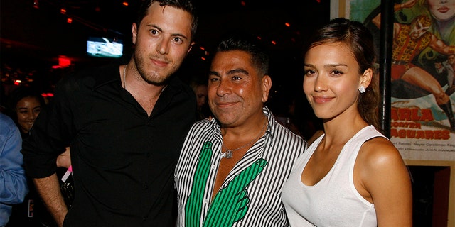 Harry Morton, left, Luis Barajas, the founder of Flaunt magazine, and Jessica Alba at the opening of a Pink Taco restaurant in Los Angeles, in 2007. (AP Photo/Chris Polk, File)