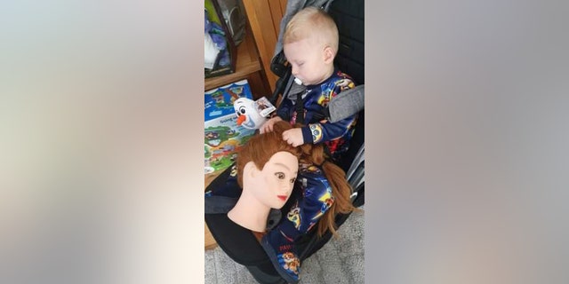 Ilarni Clark said her 14-month-old son, Harry, has shocked her and her partner with his newfound fixation for a life-size, female doll head that the young mom introduced to stop her son’s habit of pulling her hair.