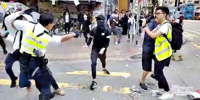 The video, which was posted on Facebook by online video outlet Cupid Producer, showed a police officer collaring one protester and then shooting another who approached.