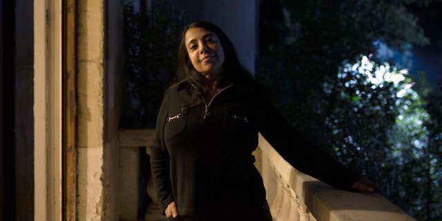 In this Monday, Nov. 11, 2019 photo, human rights lawyer Huda Nasrallah poses for a portrait at her office in Cairo, Egypt (AP Photo/Maya Alleruzzo)