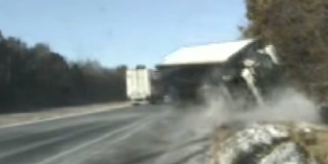 The truck nearly hit two Illinois state troopers and a woman they were assisting on the side of the road on Nov. 12, 2019.