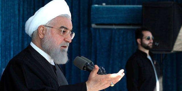 Iranian President Hassan Rouhani on Monday called on hard-liners to support the country's troubled nuclear deal, saying it could open up international arms sales for the Islamic Republic next year.