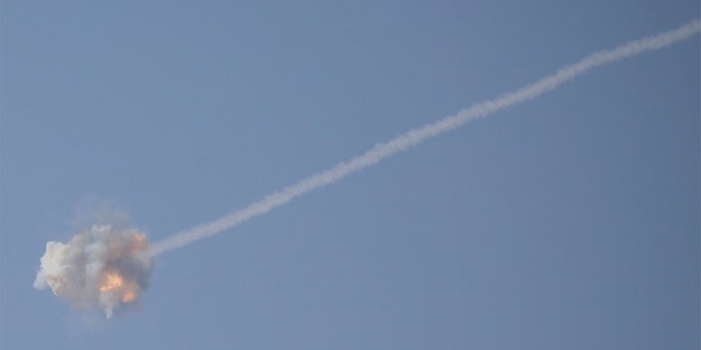 An Israeli Iron Dome air defense system missile is seen intercepting rockets fired from Gaza over Sderot, southern Israel, Wednesday, Nov. 13, 2019. (AP Photo/Ariel Schalit)