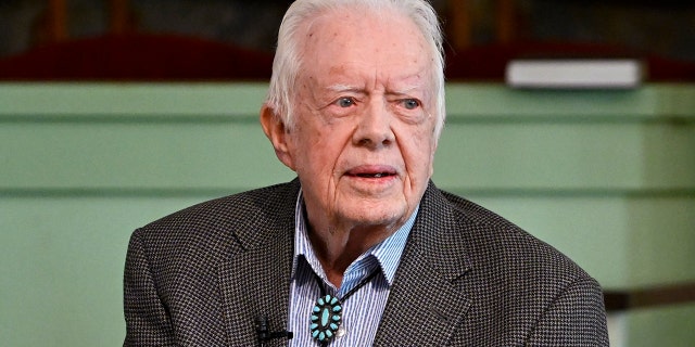 Former President Jimmy Carter, who was spotted here earlier this month in Georgia, was hospitalized on Monday. (AP Photo / John Amis, File)