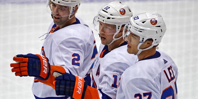 New York Islanders' Josh Bailey (12) celebrates after scoring during the third period of an NHL hockey game against the Pittsburgh Penguins in Pittsburgh, Tuesday, Nov. 19, 2019. The Islanders won 5-4 in overtime. (AP Photo/Gene J. Puskar)