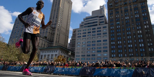 Geoffrey Kamworor, of Kenya, leads the professional men's division during the New York City Marathon, Sunday, Nov. 3, 2019, in New York.