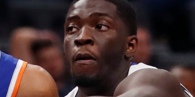New York Knicks guard Allonzo Trier (14) looks to pass as Detroit Pistons guard Khyri Thomas (13) defends during the second half of an NBA basketball game, Wednesday, Nov. 6, 2019, in Detroit. (AP Photo/Carlos Osorio)