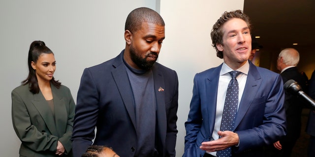 From left, Kim Kardashian West, North West, Kanye West and Joel Osteen answering questions after the 11 a.m. service at Lakewood Church in Houston this past November. (AP Photo/Michael Wyke)
