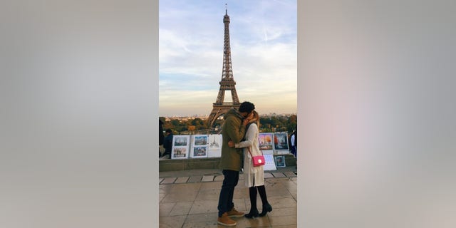 Kristiana Kuqi, 23, kisses stranger in front of the Eiffel Tower in Paris, France. (Photo courtesy of Kristiana Kuqi/Twitter)