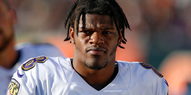 Baltimore Ravens quarterback Lamar Jackson walks the sidelines during the second half of NFL football game against the Cincinnati Bengals, Sunday, Nov. 10, 2019, in Cincinnati. (AP Photo/Gary Landers)