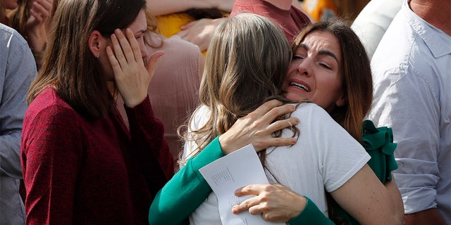 People attend the funeral of Dawna Ray Langford, 43, and her sons Trevor, 11, and Rogan, 2, who were killed by drug cartel gunmen, at a family cemetery in La Mora, Sonora state, Mexico, Thursday, Nov. 7, 2019.