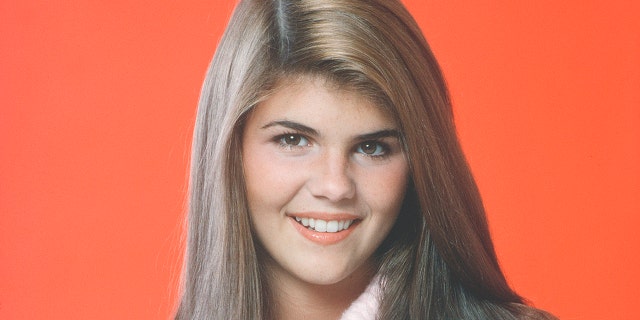 Lori Loughlin, pictured here in 1982, looks just like her daughter, Bella, in a new throwback picture.