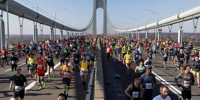 Runners make their way across the Verrazano-Narrows Bridge during the start of the New York City Marathon, Sunday, Nov. 3, 2019, in New York.