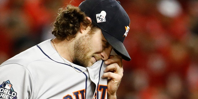 Houston Astros starting pitcher Gerrit Cole walks to the dugout after the third inning of Game 5 of the baseball World Series against the Washington Nationals Sunday, Oct. 27, 2019, in Washington. (AP Photo/Patrick Semansky)