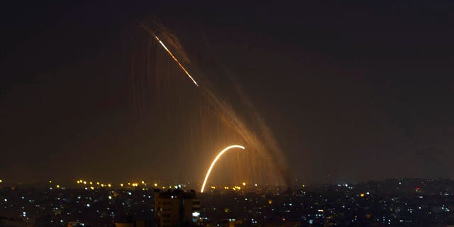 Rockets are launched from the Gaza Strip towards Israel, Wednesday, Nov. 13, 2019. (AP Photo/Khalil Hamra)
