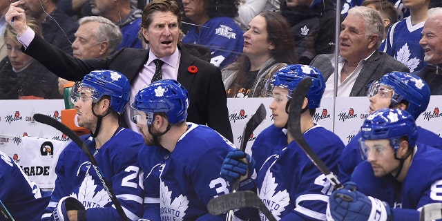 Toronto Maple Leafs coach Mike Babcock reacts as his team plays the Vegas Golden Knights during the third period of an NHL hockey game Thursday, Nov. 7, 2019, in Toronto. (Nathan Denette/The Canadian Press via AP)