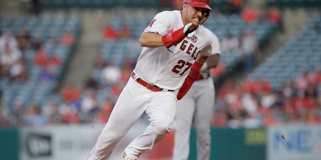 FILE - In this July 30, 2019, file photo, Los Angeles Angels' Mike Trout rounds second to advance to third from first on a single by Shohei Ohtani against the Detroit Tigers during the first inning of a baseball game in Anaheim, Calif. Trout was having another spectacular year for the Angels when right foot problems ended his season early. He did not play after Sept. 7 and was limited to 134 games. (AP Photo/Alex Gallardo, File)