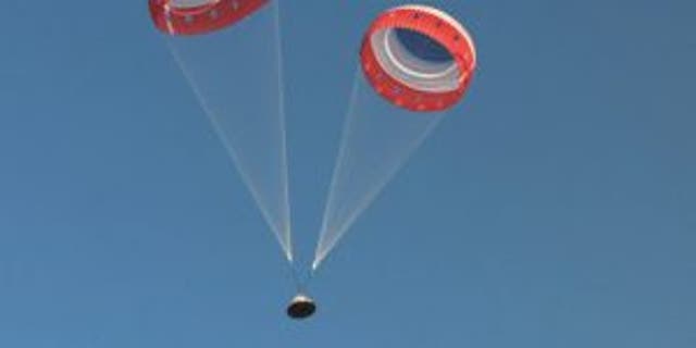 Parachutes deploy on the Starliner capsule. (Image credit: NASA TV)
