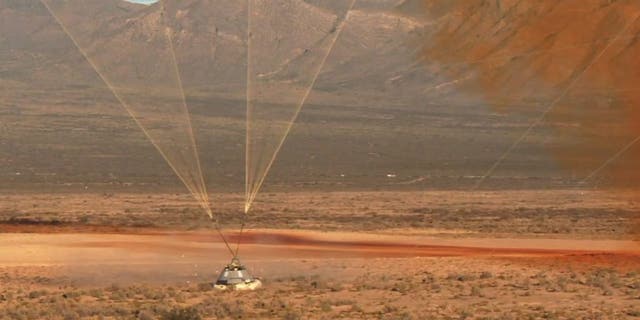 The Starliner capsule lands in the New Mexico desert. (Image credit: NASA TV)